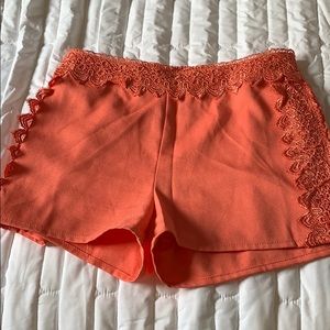 Peach colored shorts with lace detail